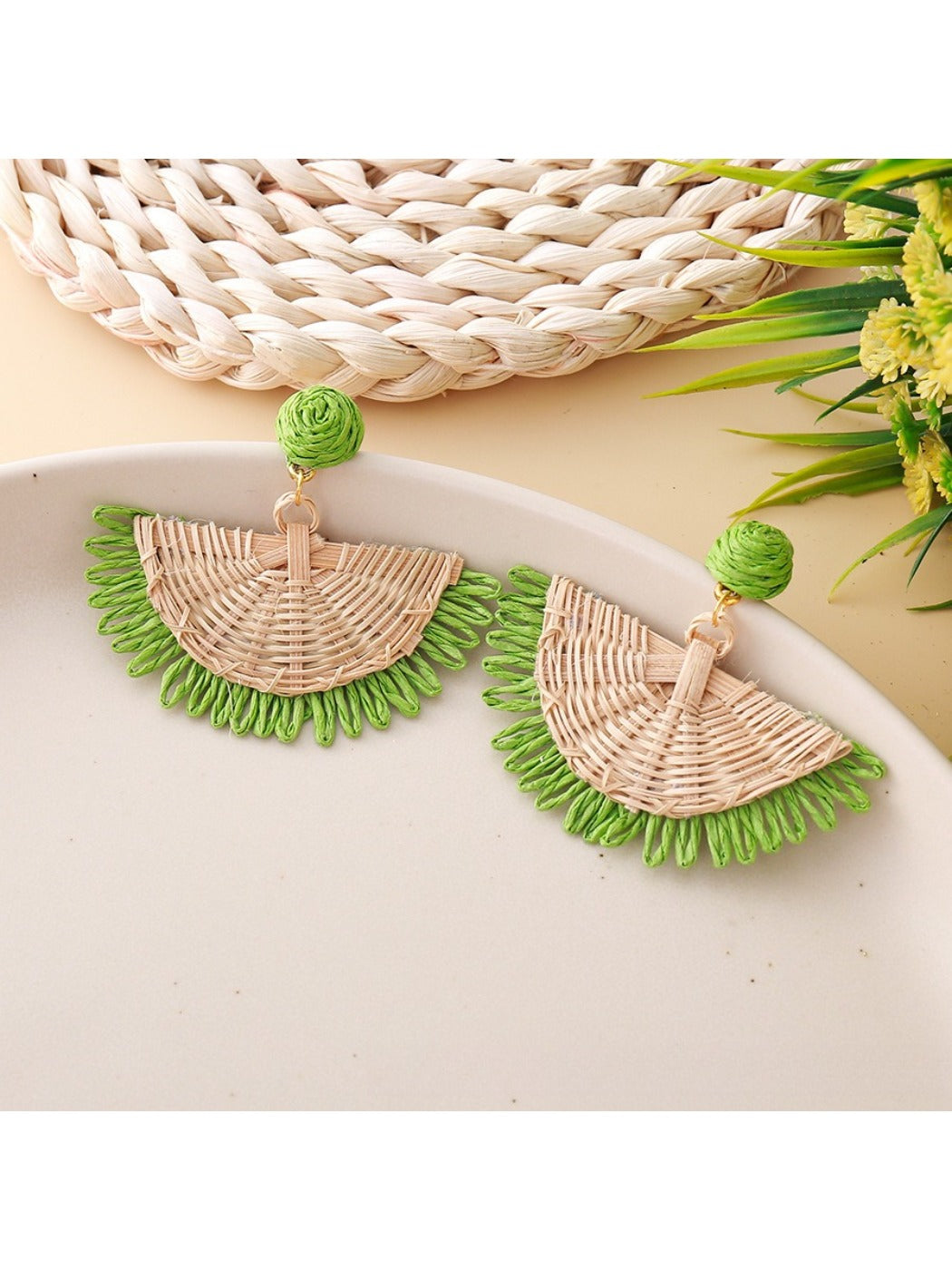 Earedge raffia fan shaped drop earrings photographed with natural lighting