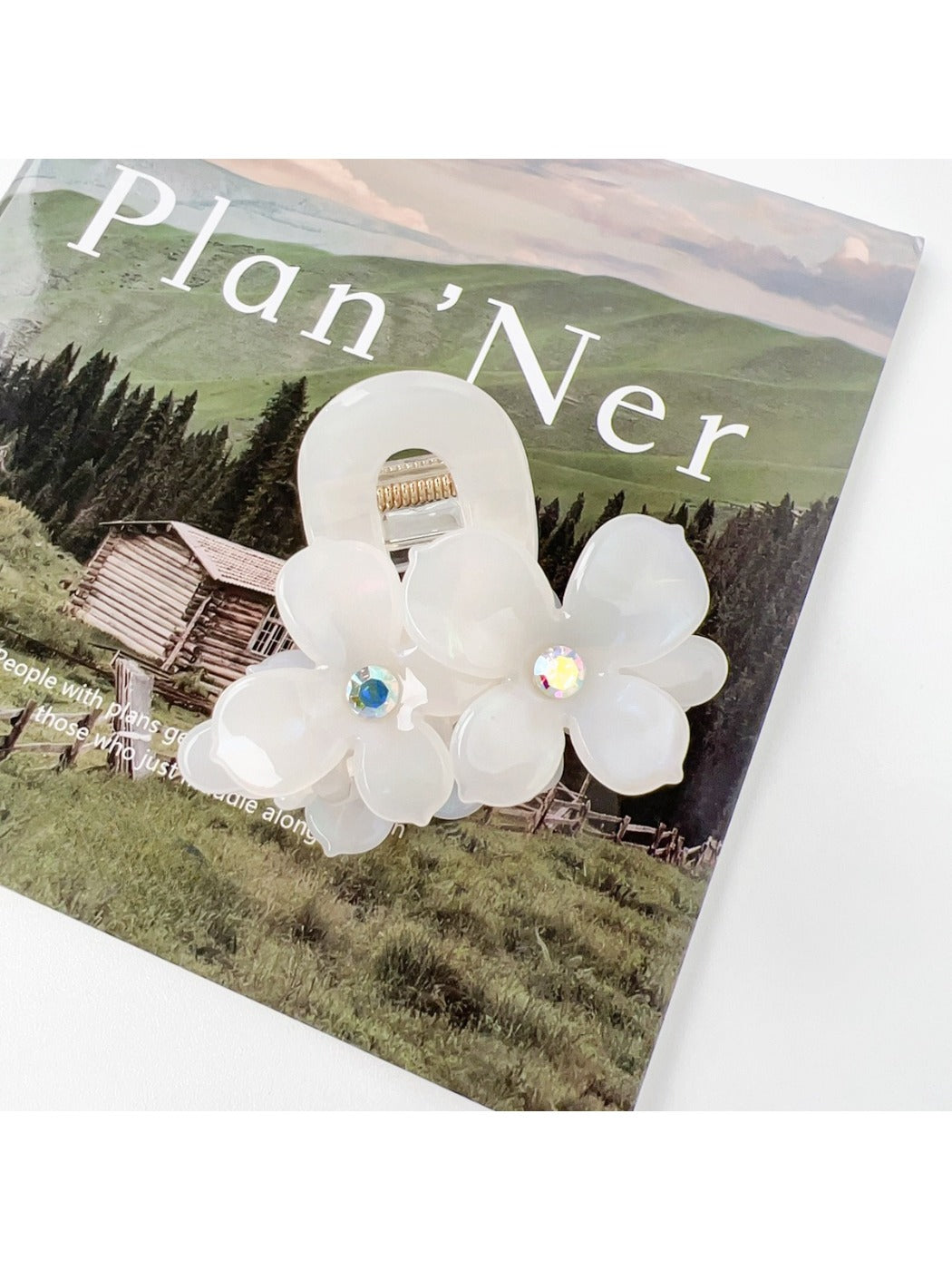 Beau vintage double flower hair claw clip photographed with natural lighting