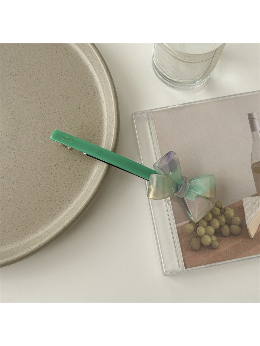 Beau bow bar hair clip displayed alongside matching minimalist hair accessories