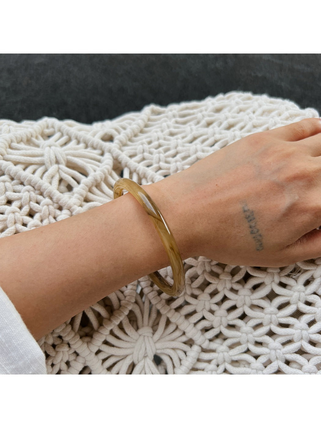 Lovra vintage ombre bangle bracelet displayed with matching accessories