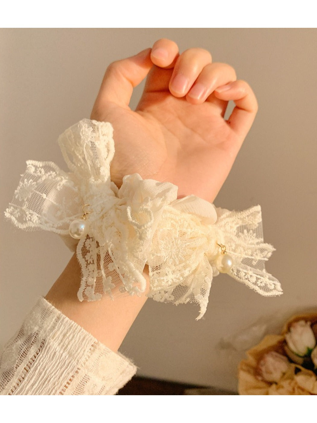 White lace bow scrunchie styled in a ponytail