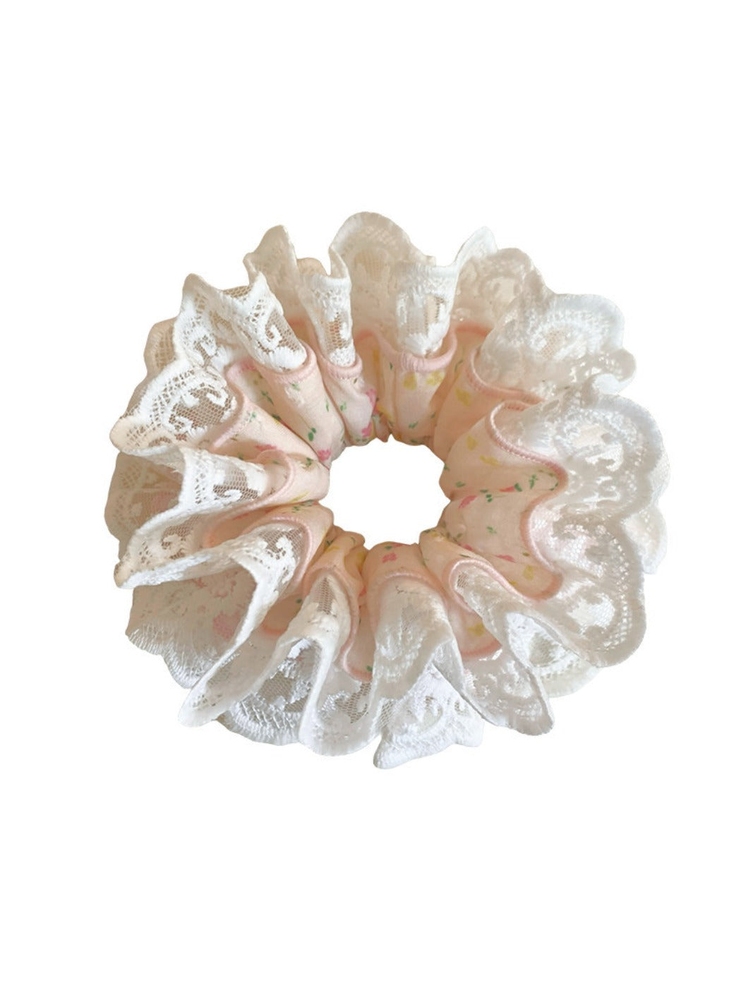 Gifty sweet light pink scrunchie folded neatly on a fabric surface