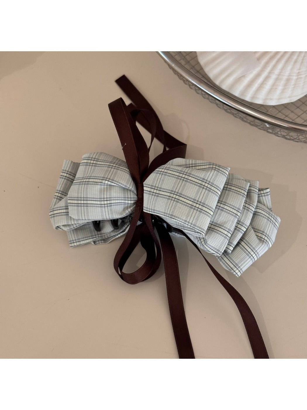 Beau delicate bow hair clip packaging with branding and product details