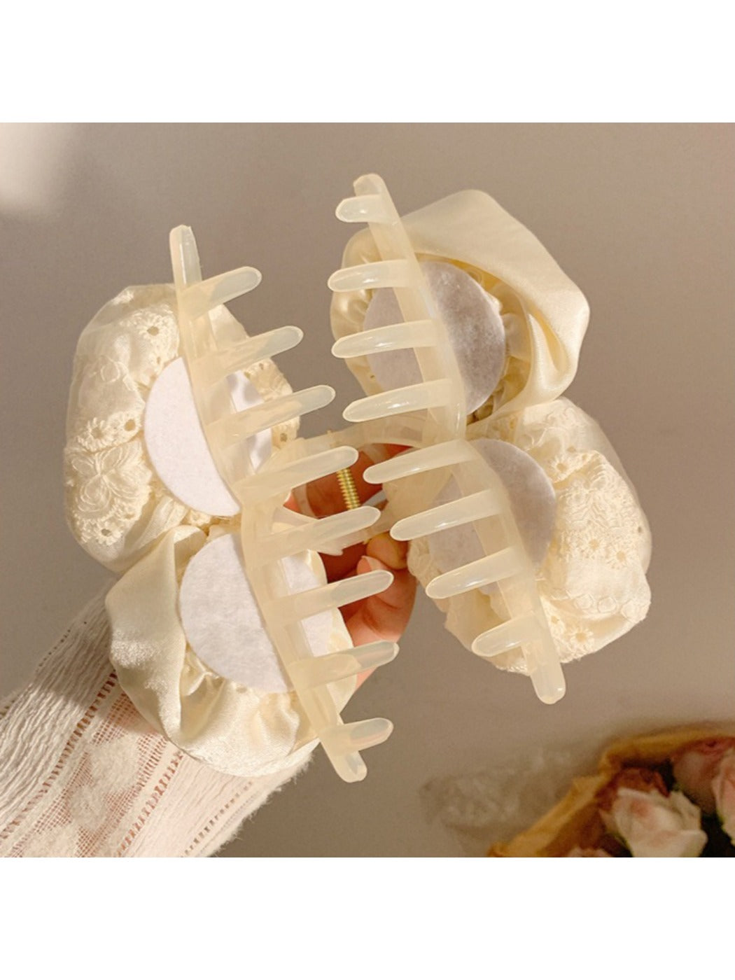 Beau hair claw clip displayed on a white background emphasizing its delicate rose decor