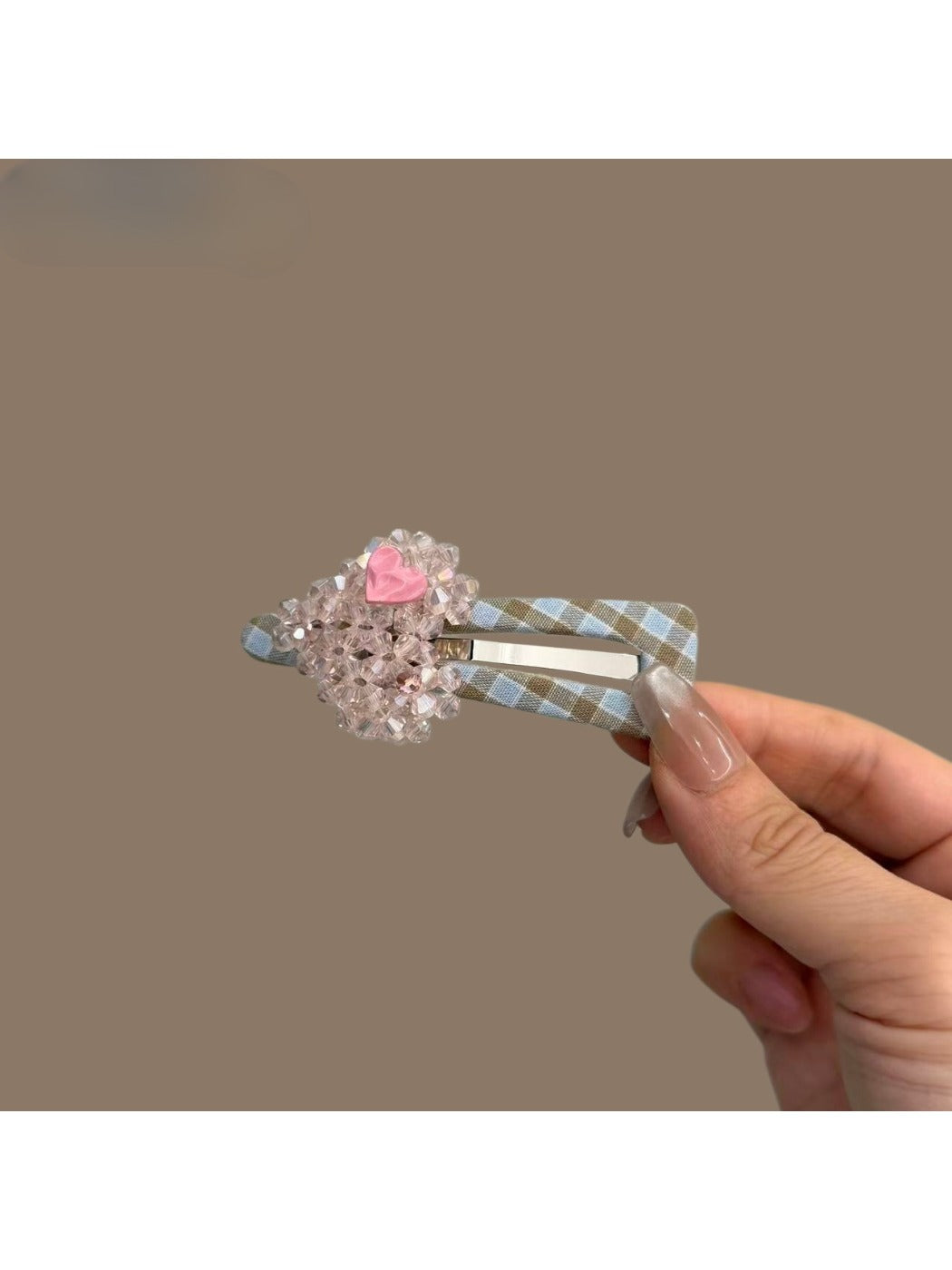 Plaid beaded heart hair clip shown with matching accessories on a flat surface
