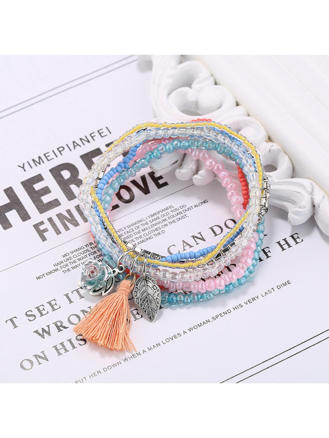 Lovra multi-row beaded bracelet with tassel styled with casual outfit