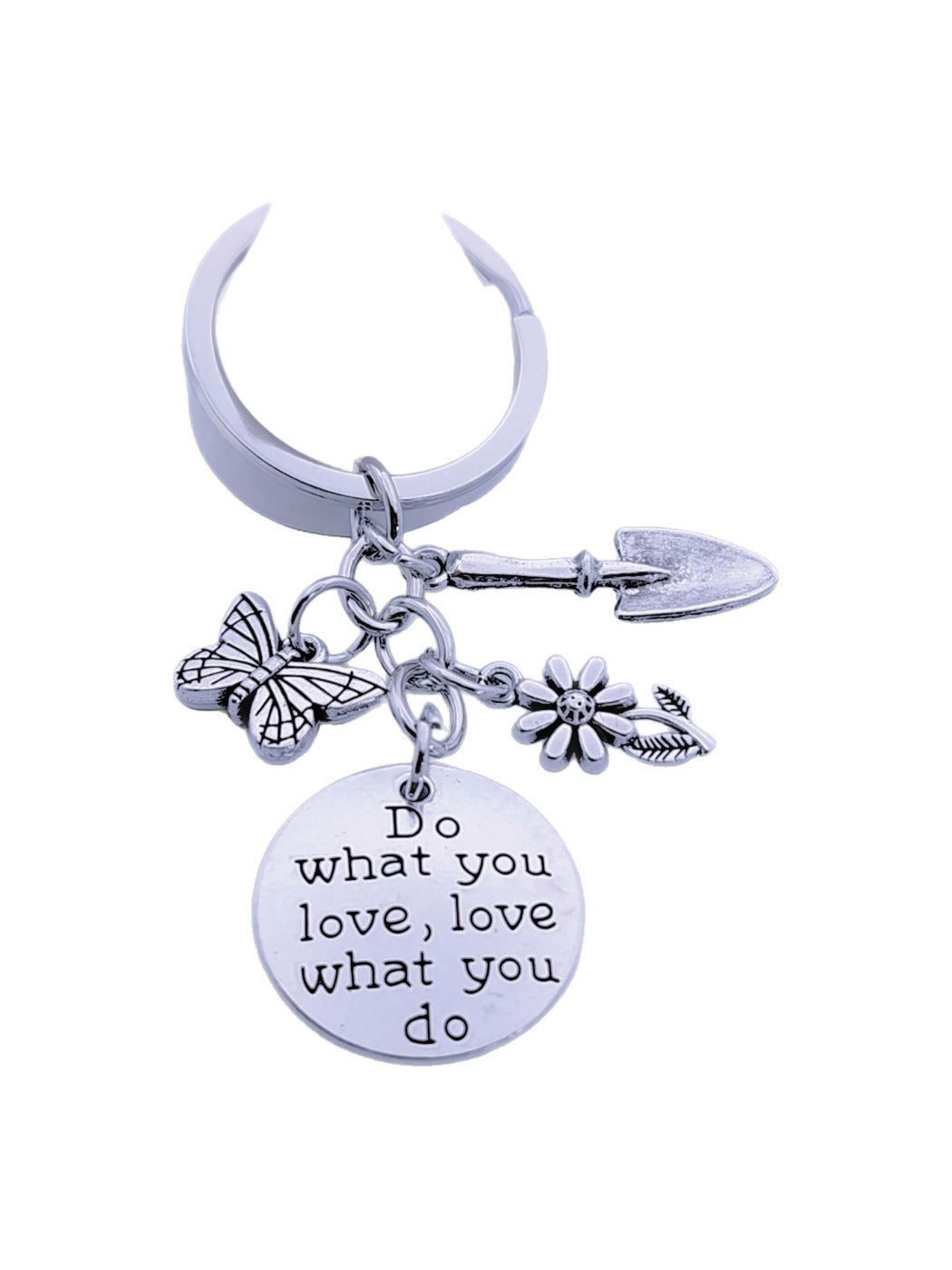 Butterfly flower keychain hanging from a bag zipper with natural light