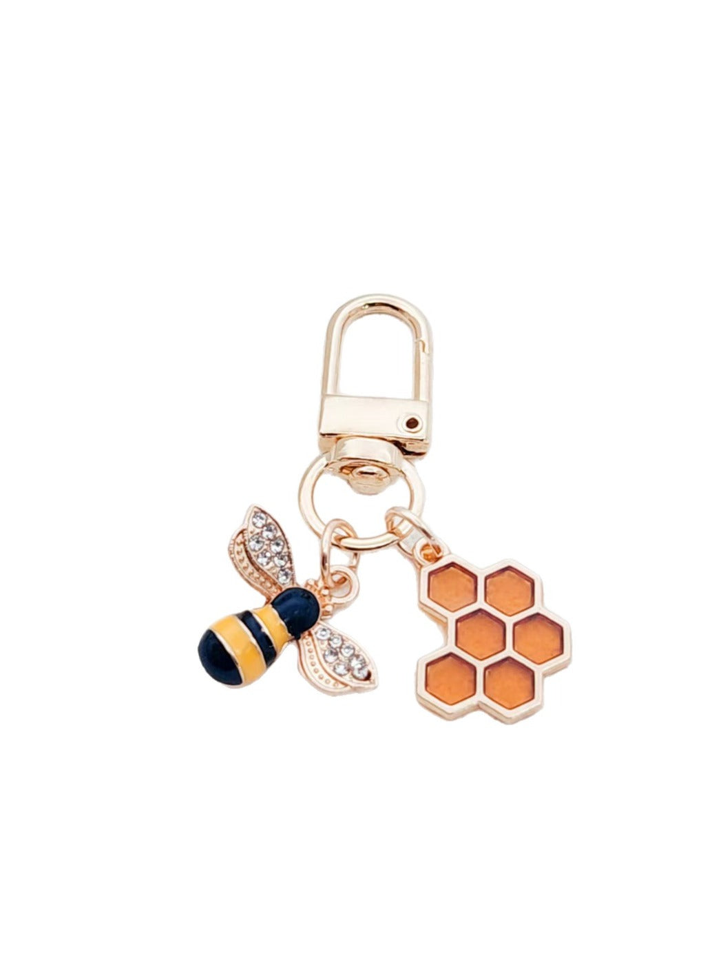 Side angle of bee and honeycomb shaped keychain with metal ring