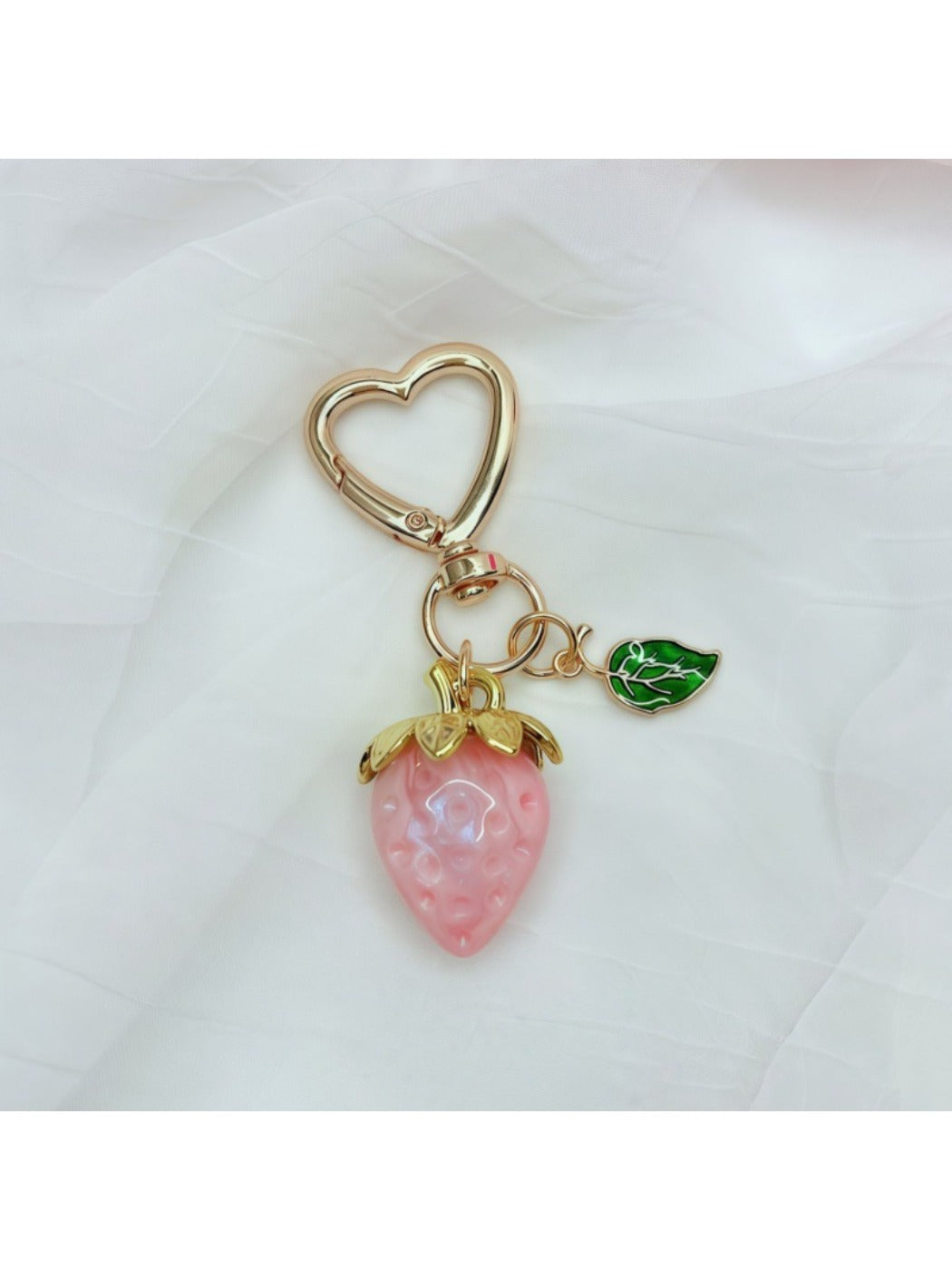 Keypus strawberry charm keychain close-up showing realistic strawberry design