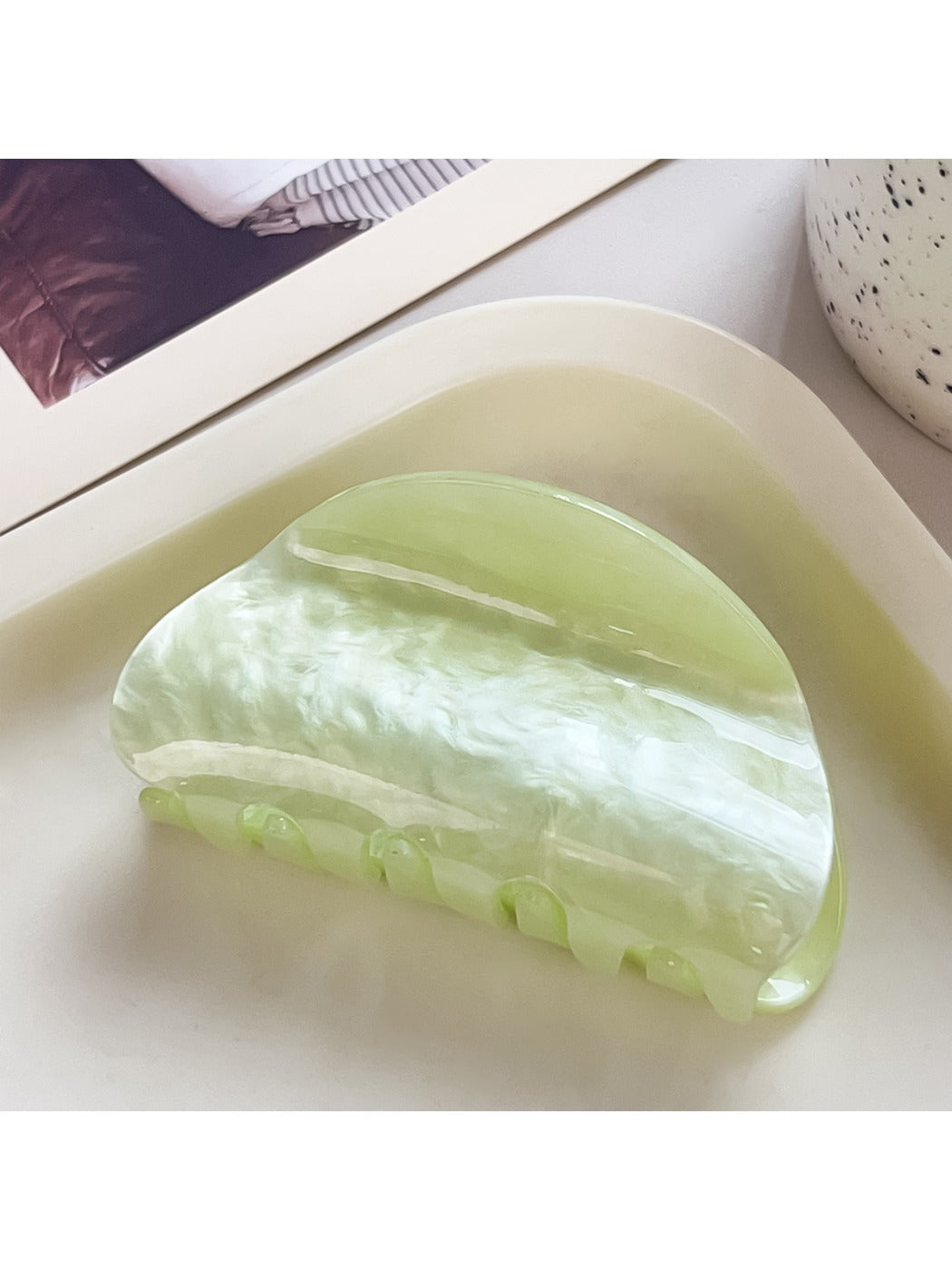 Beau macaron colored crescent claw clip in a styled hair updo