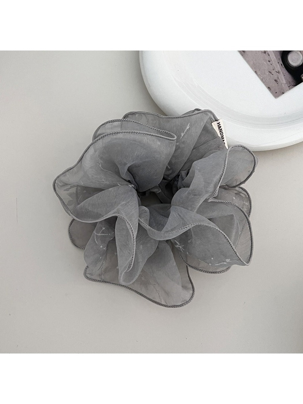 Multiple Gifty ruffled scrunchies in different colors arranged together