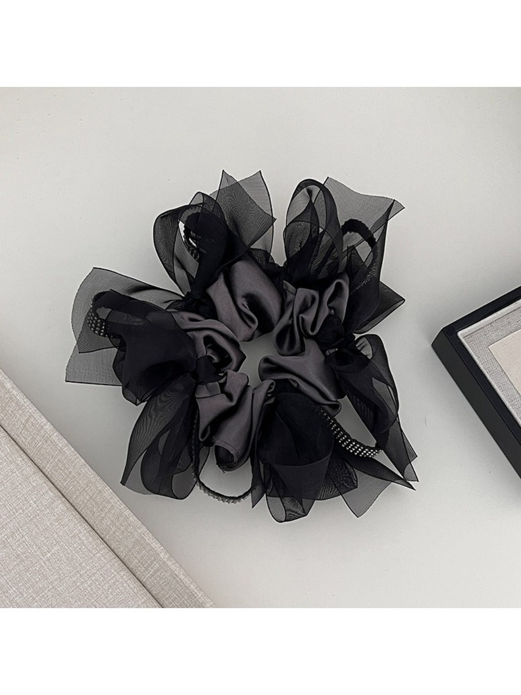 Gifty dark large bow scrunchie displayed flat with bow spread out