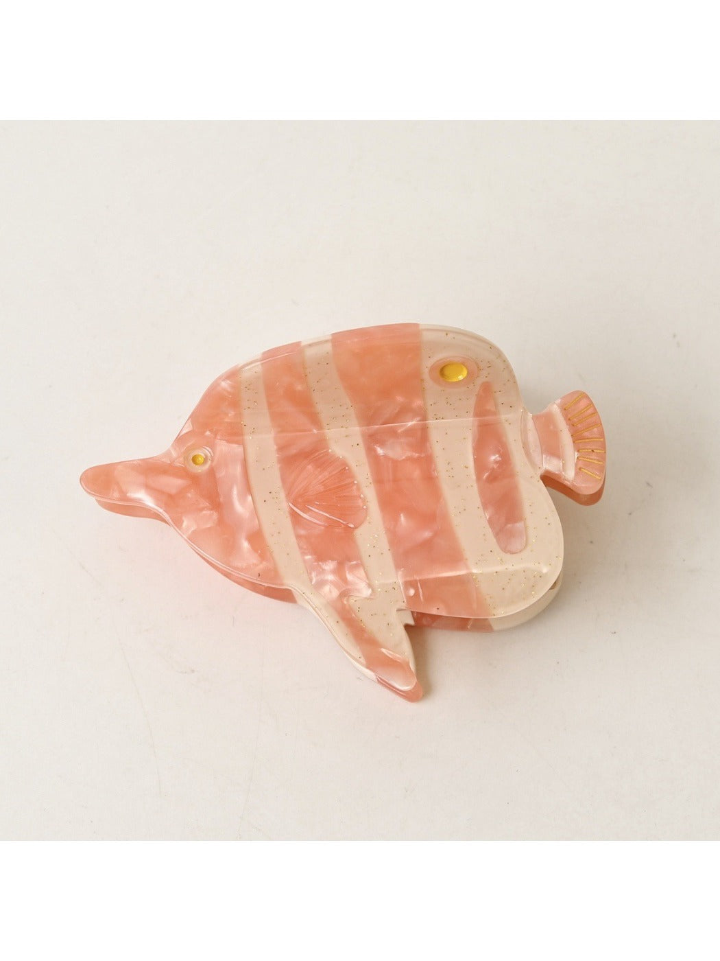 Beau fish claw clip with bright blue and orange colors on a plain white background