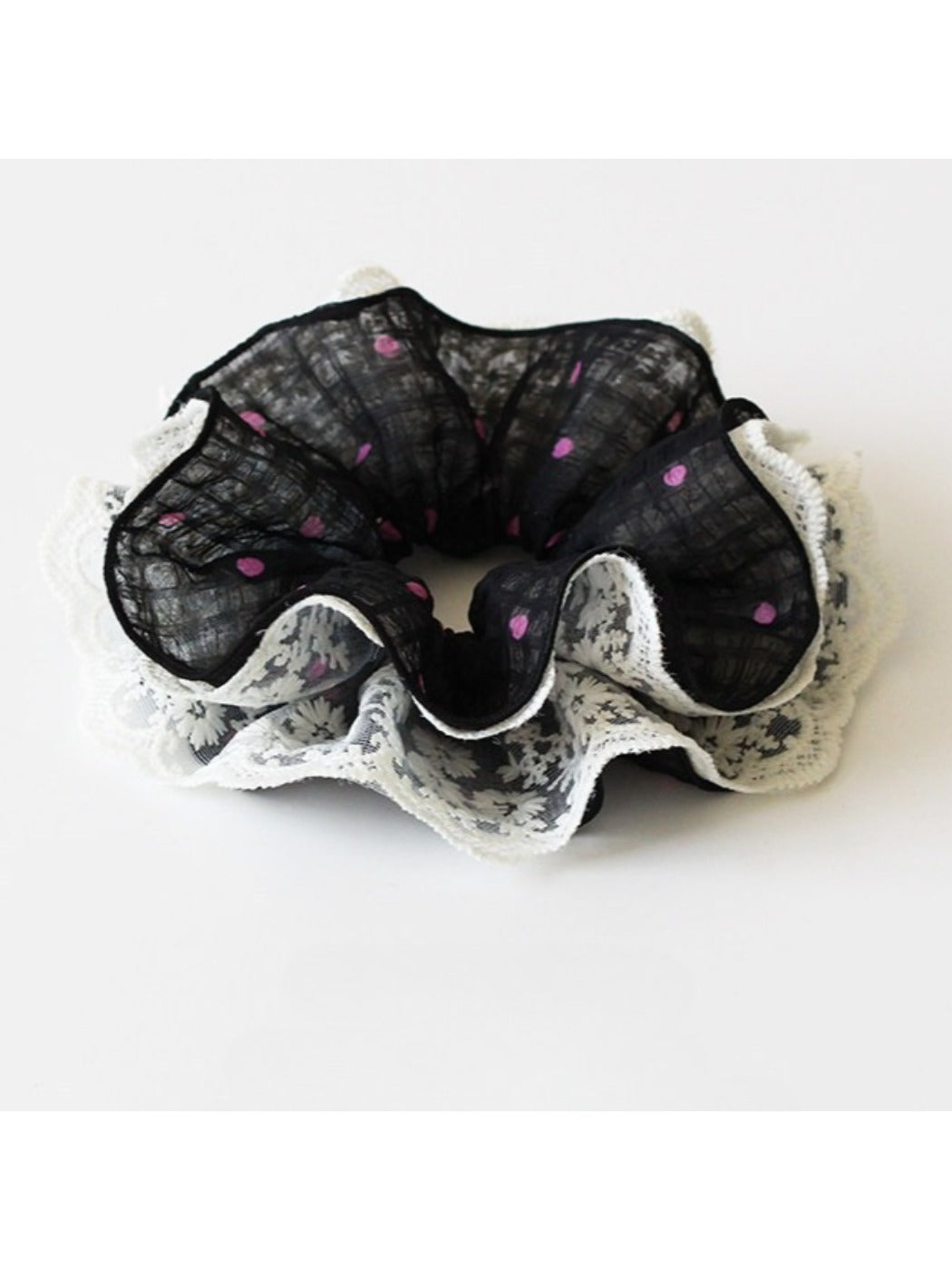 Gifty scrunchie with ruffled edges and classic white polka dots on fabric