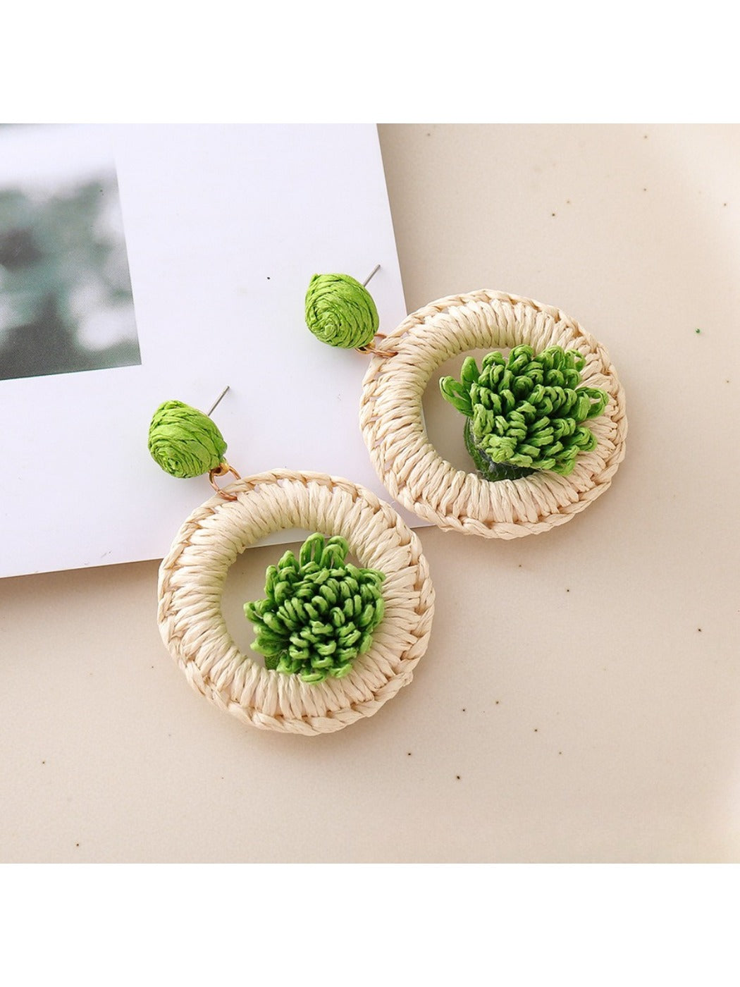 Detailed shot of the natural raffia fibers used in Earedge woven earrings