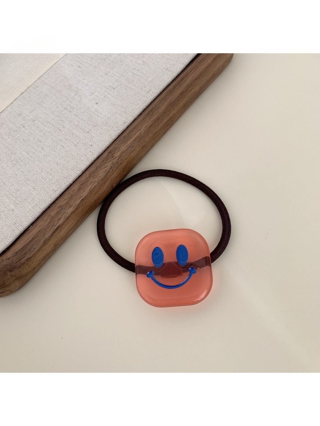 Gifty - Block Smiley Face Hair Tie
