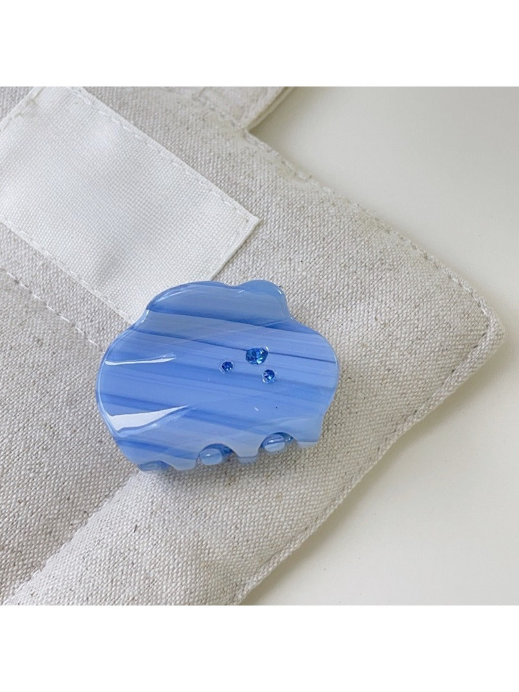 Beau cloud shaped hair claw clip displayed with soft natural lighting
