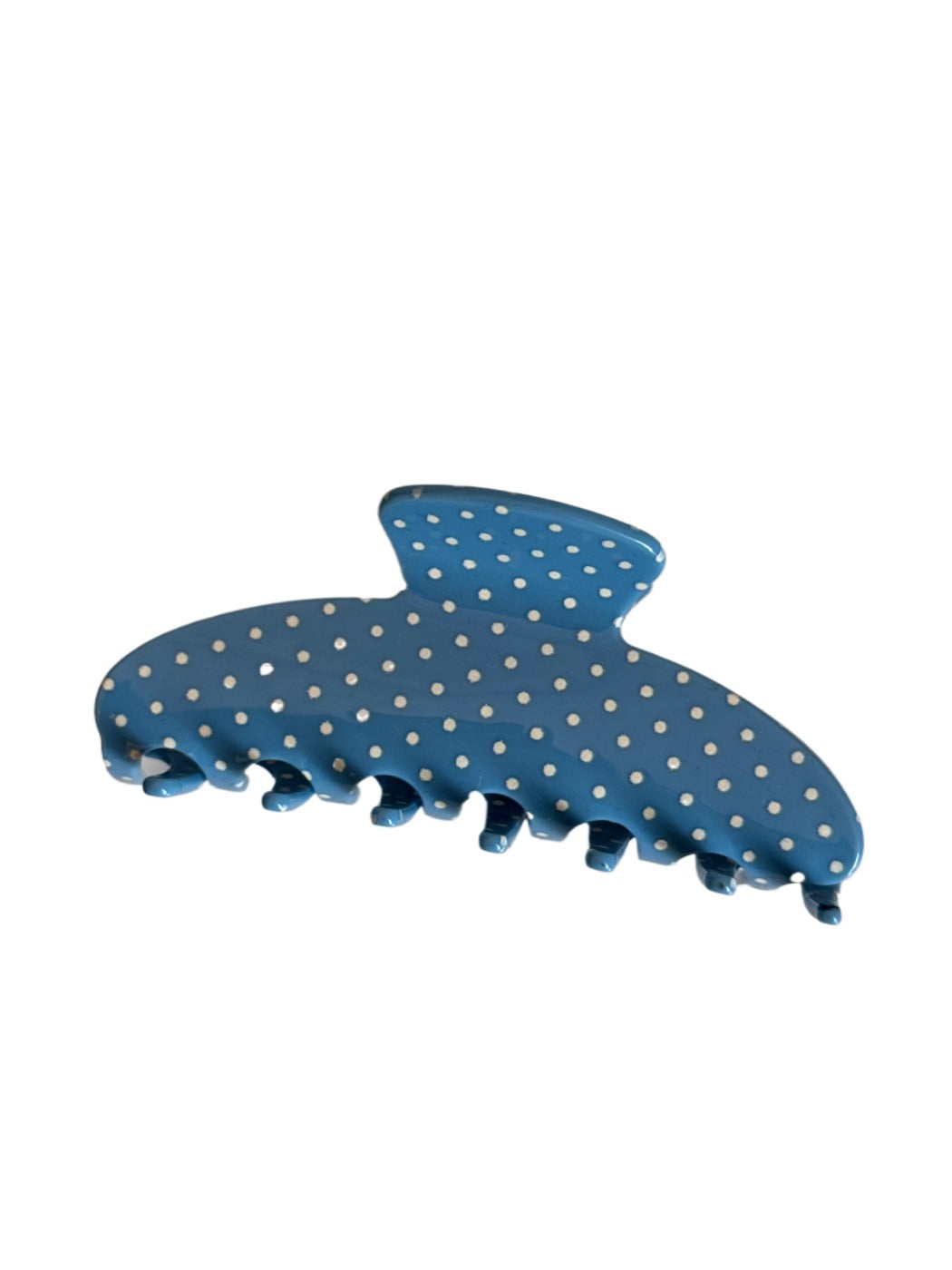Beau acetate hair clip with vibrant polka dots displayed against a pastel background