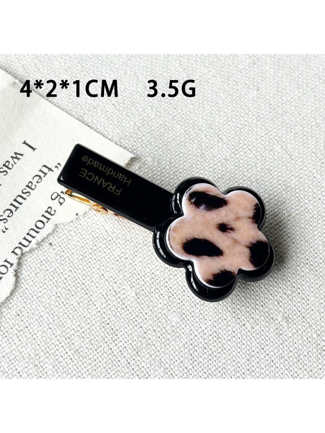 Beau flower and heart acrylic hair clip packaged in clear plastic box