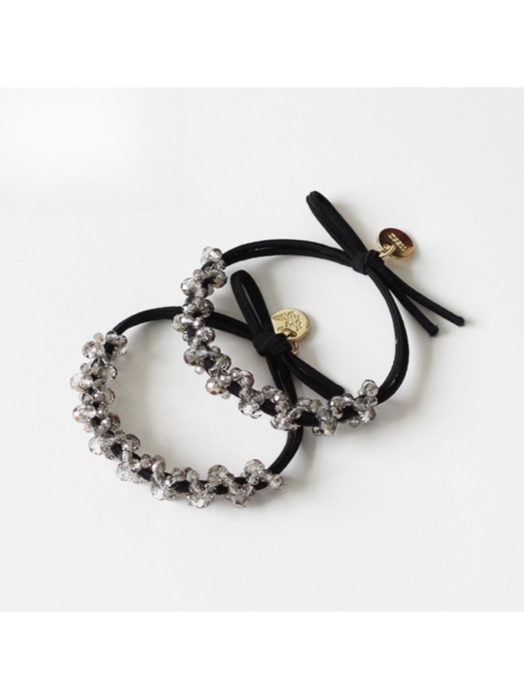 Multiple Gifty minimalist beaded hair ties displayed in a row with varied bead colors