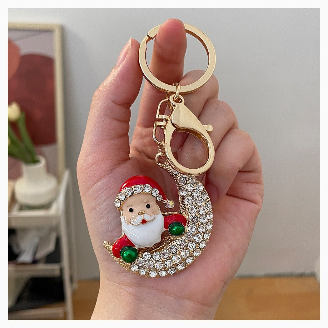 Christmas Santa crescent moon keychain held in hand