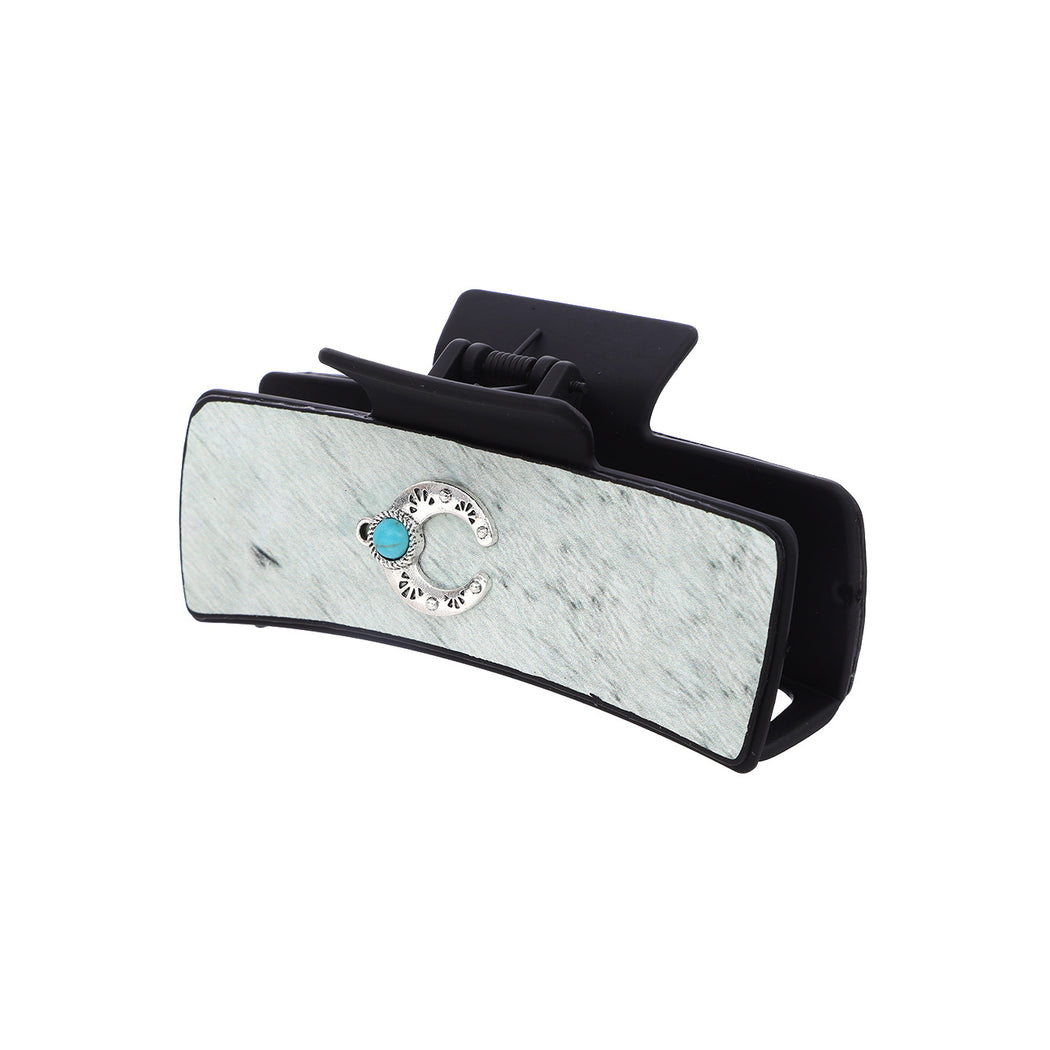 Turquoise moon hair claw on white background