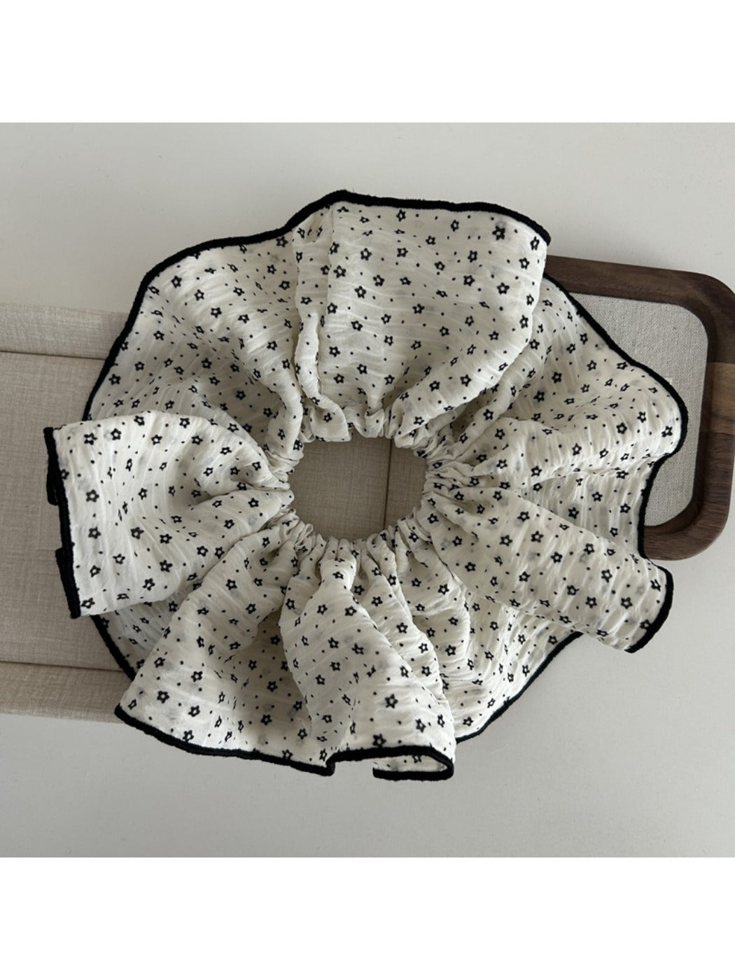 Gifty floral scrunchie worn in hair, highlighting size and pattern