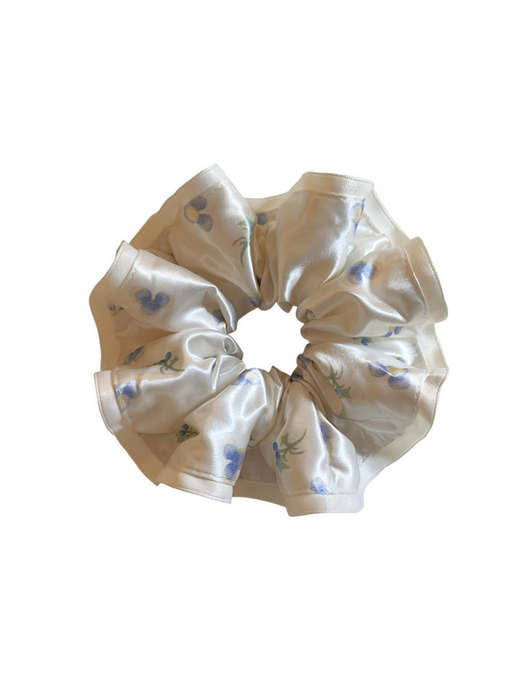 Gifty satin floral scrunchie worn on a wrist as a stylish accessory