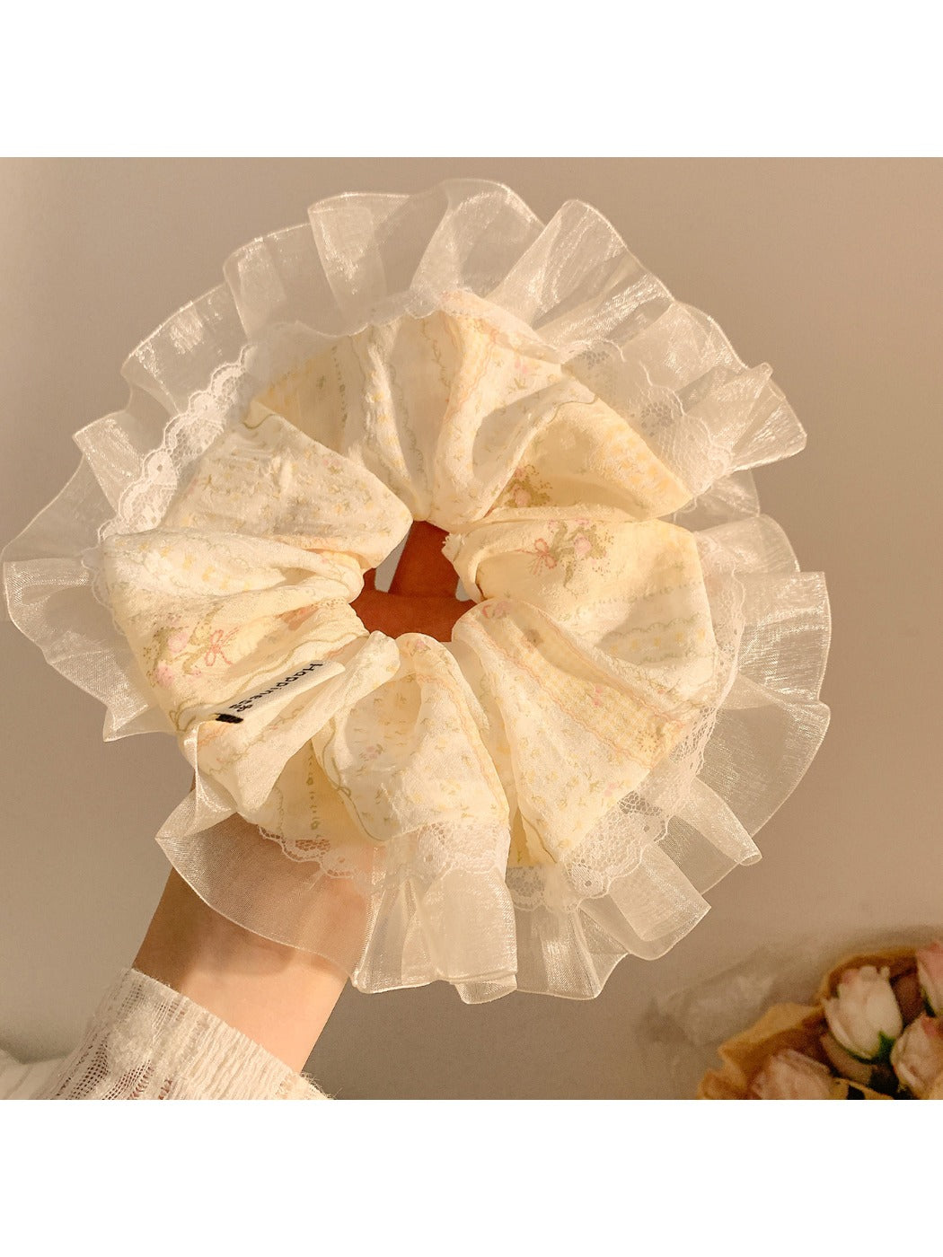 Gifty Ditsy Floral Lace Trim Scrunchie styled in hair with visible floral print and lace trim