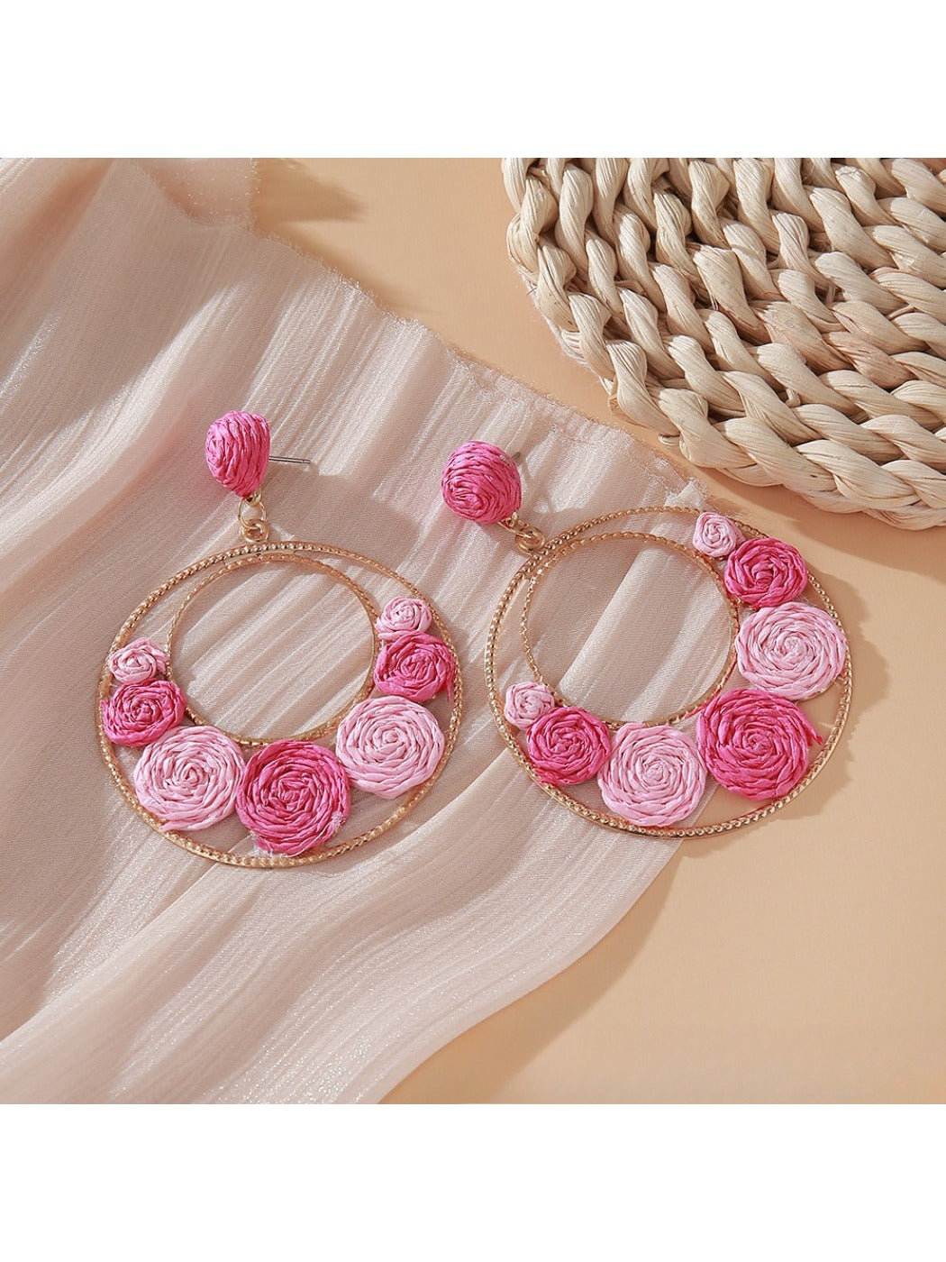 Sweet Raffia Circle Stud Earrings photographed with green plant background