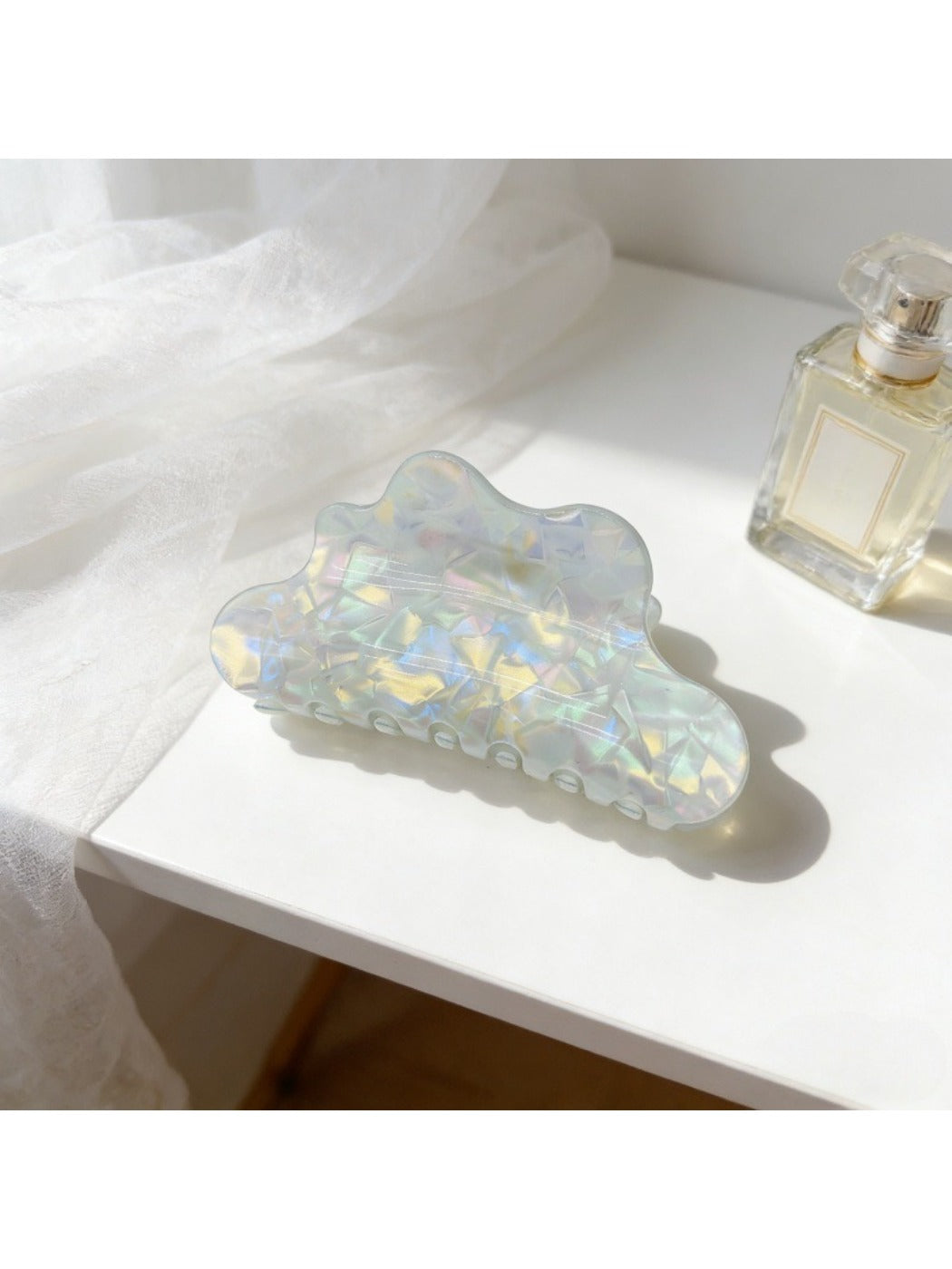 Beau holographic mermaid claw clip angled to show prong details
