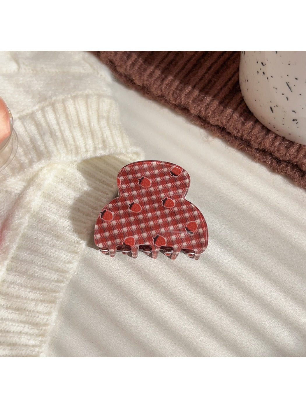 Beau plaid strawberry print hair claw clip displayed with matching accessories