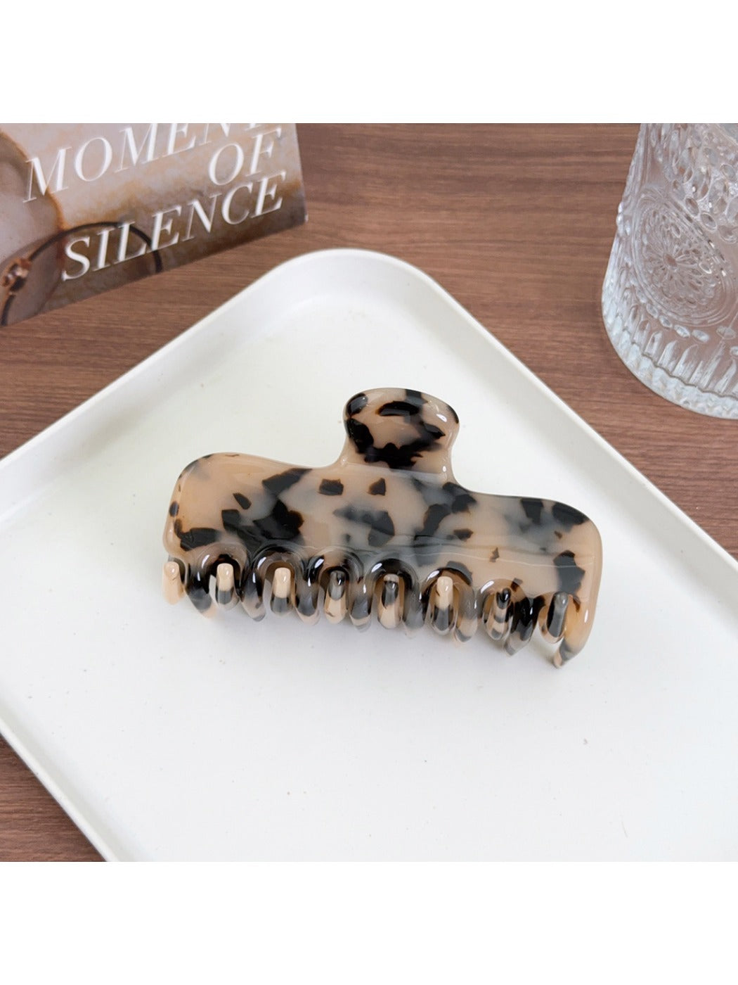 Beau minimalist square hair claw clip photographed with soft natural lighting
