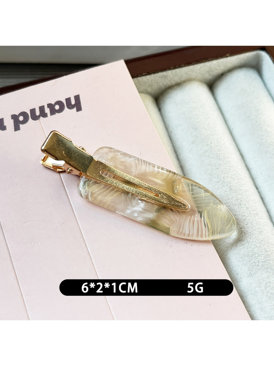 Beau acetate invisible hair clip photographed with soft natural lighting