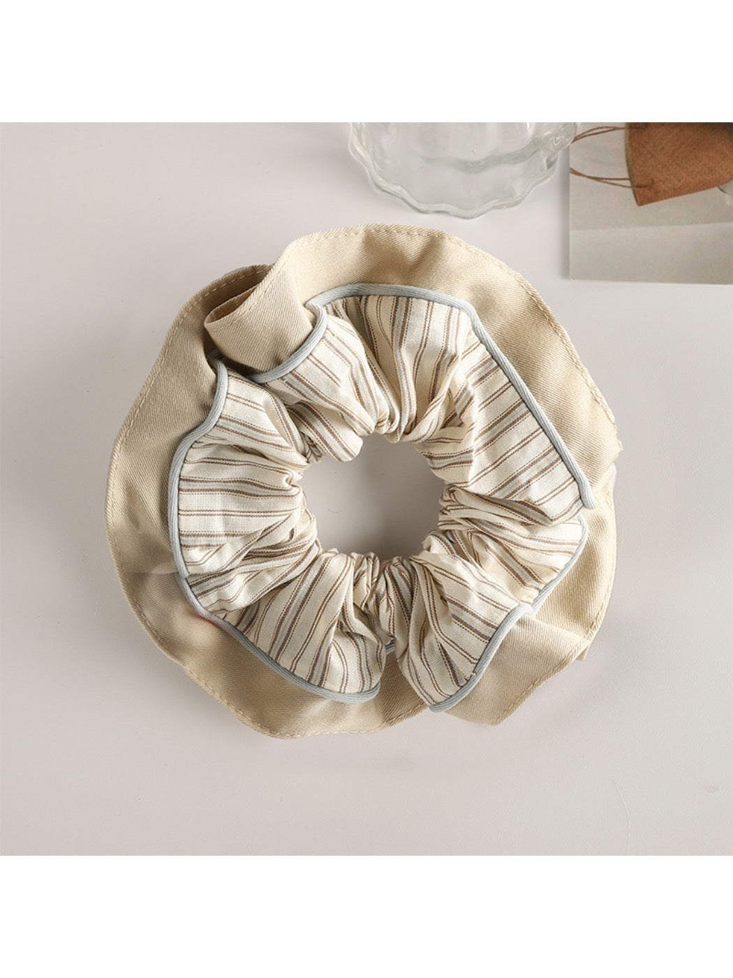 Gifty pastel scrunchie worn in hair, showcasing its gentle pastel tones and volume