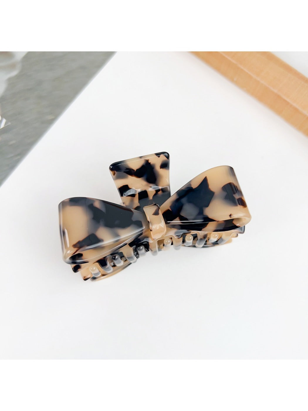 Beau bow shaped claw clip displayed in a gift box with soft padding