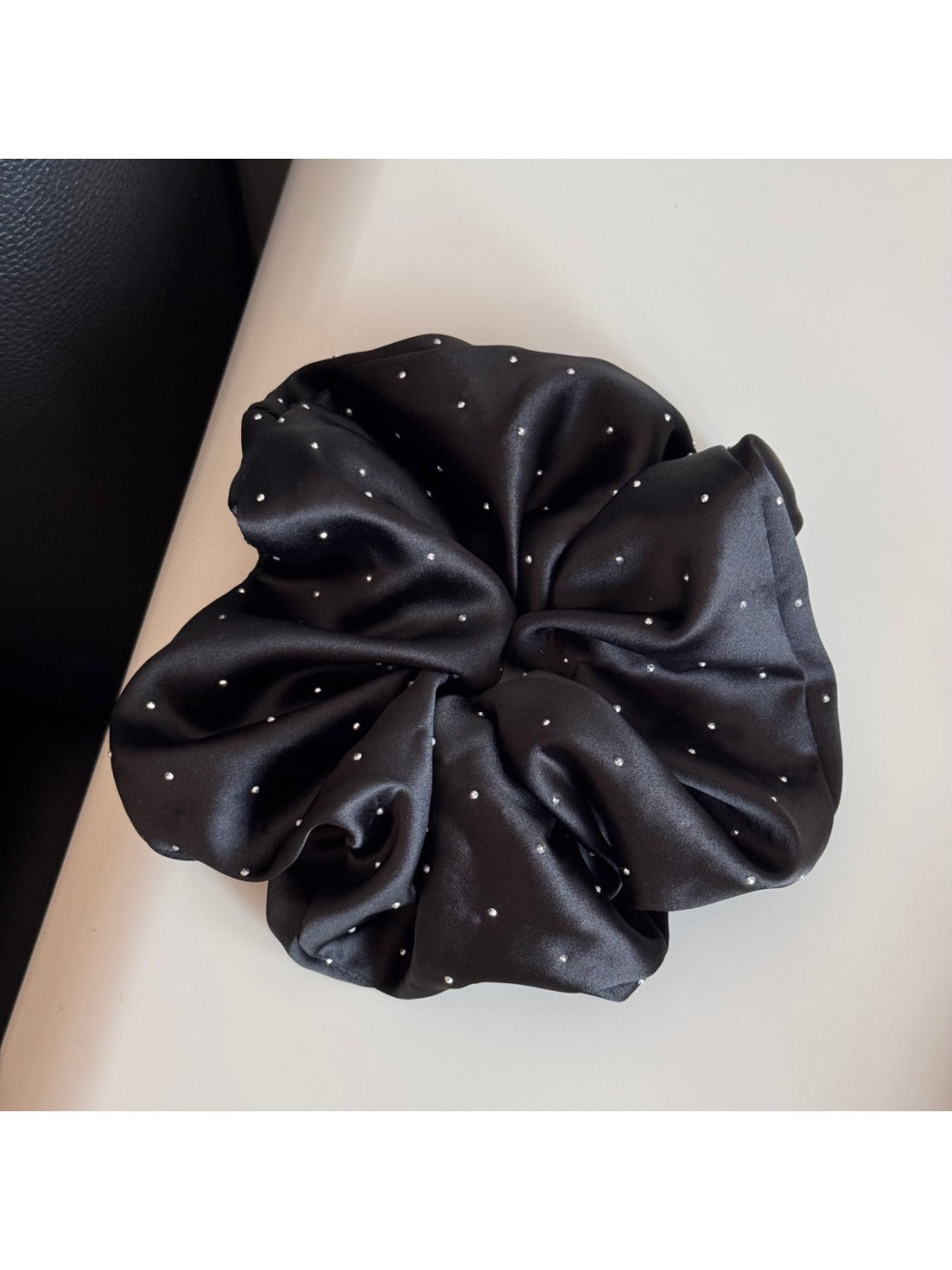 Gifty rhinestone decor satin scrunchie displayed with matching accessories