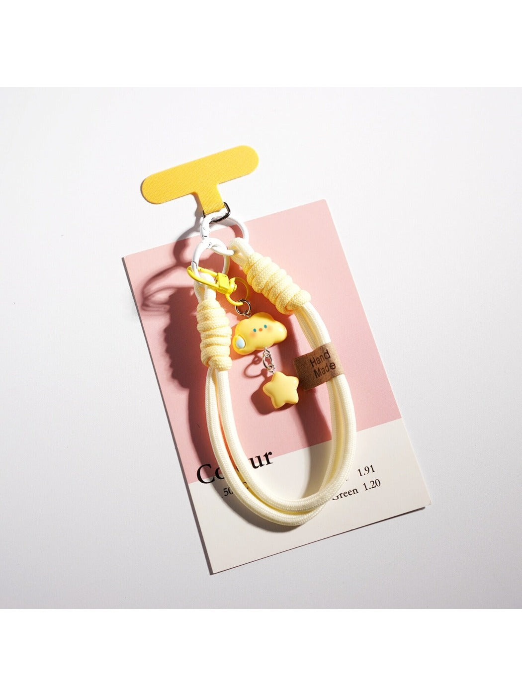 Keypus cloud and star keychain hanging from a backpack zipper pull