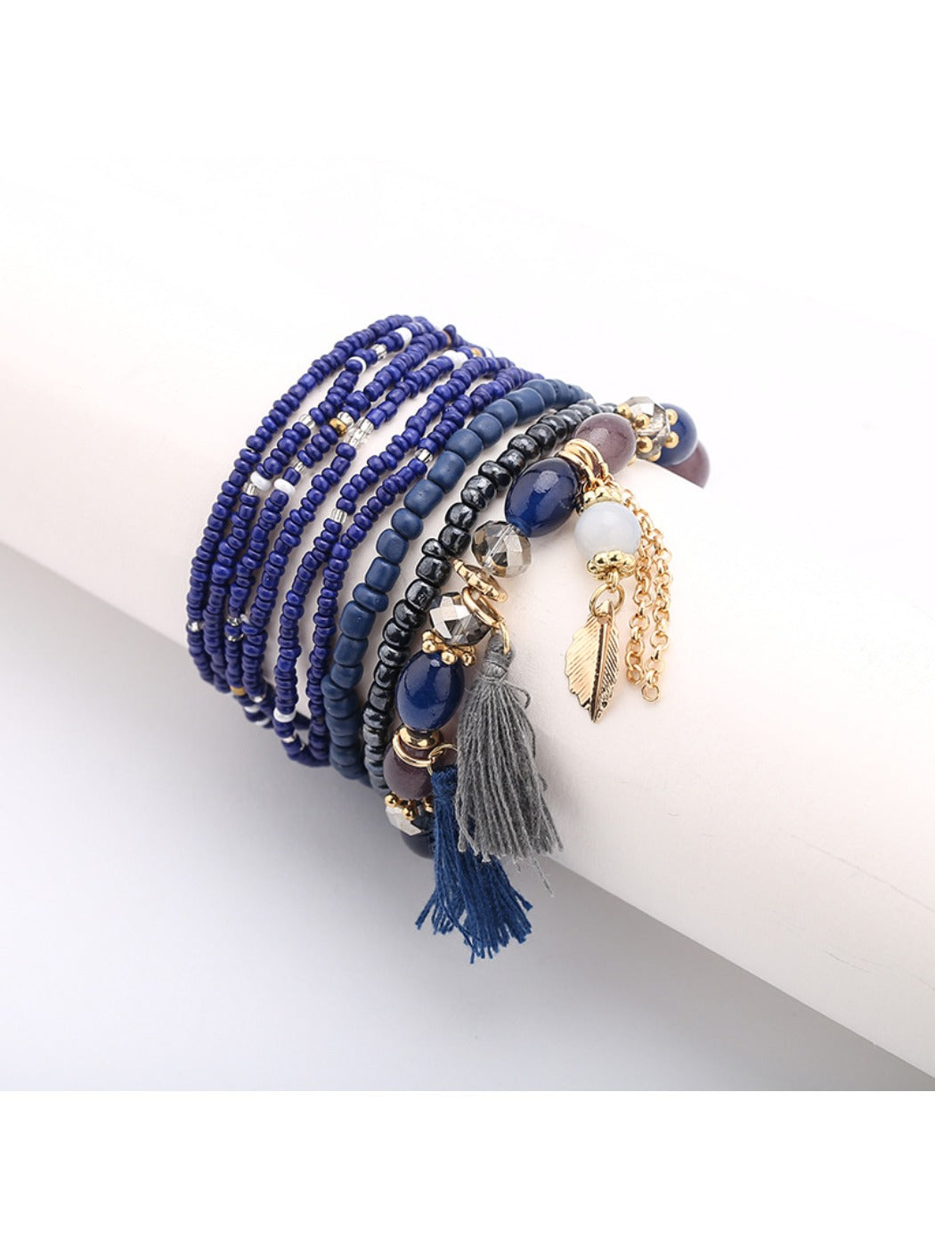 Lovra bracelet packaging with tassel pendant and colorful beads displayed