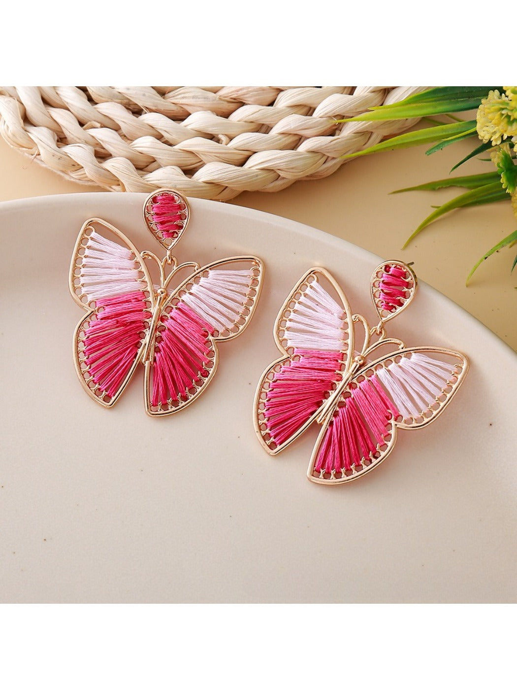 Earedge butterfly drop earrings styled with a casual outfit on a model