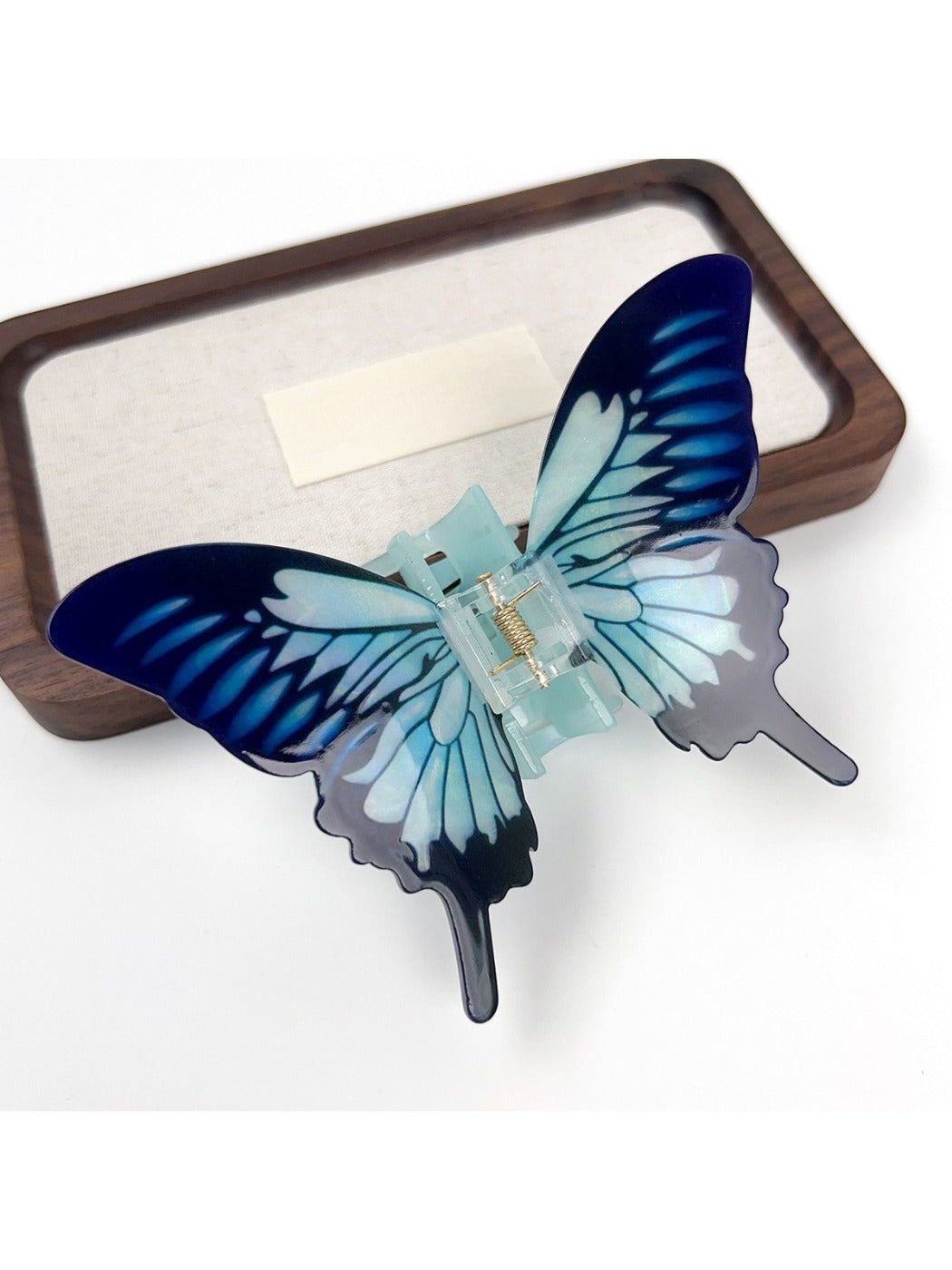 Beau butterfly hair claw clip shown from bottom to reveal teeth alignment