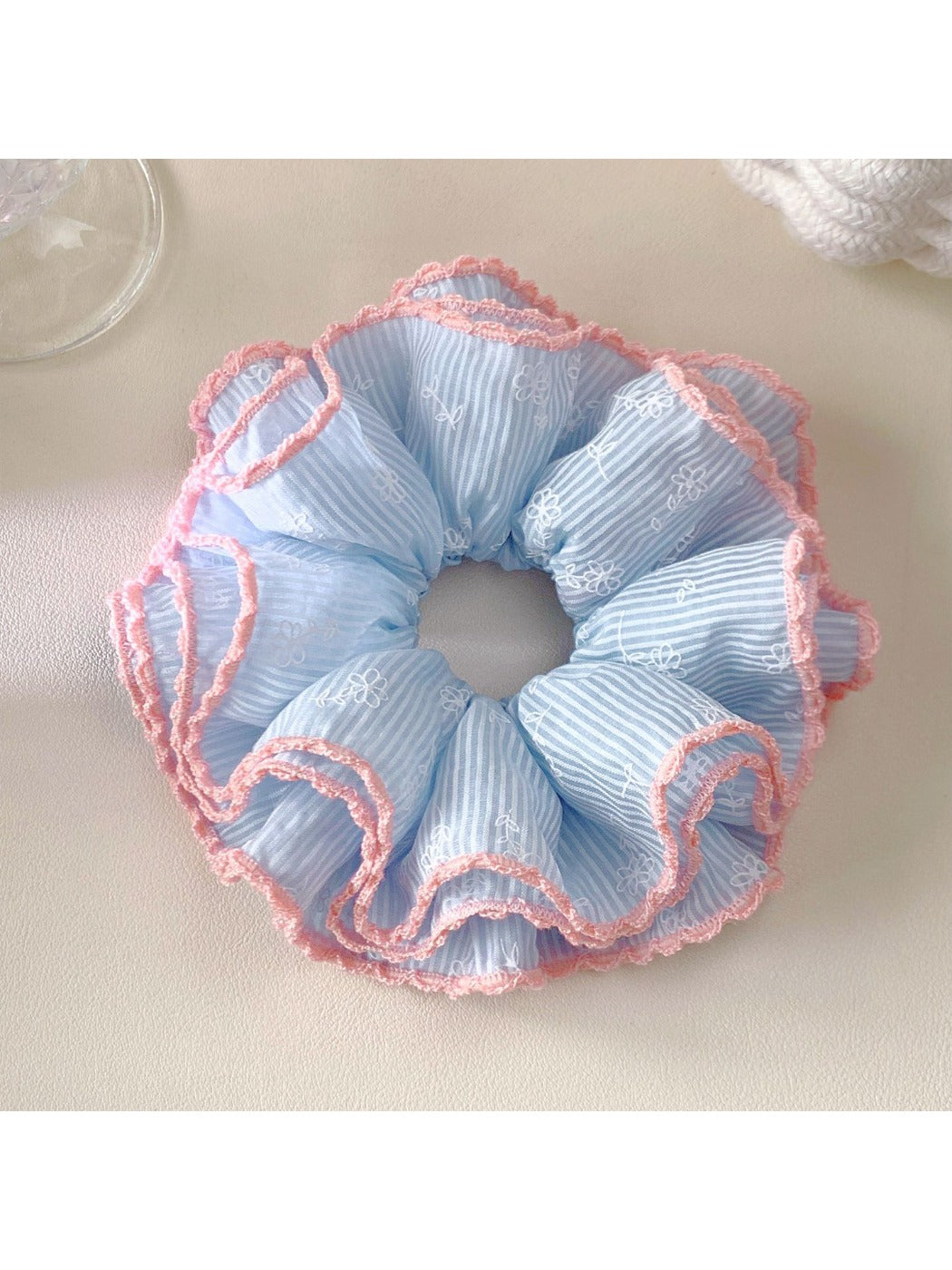 Gifty Sweet Striped Four Layer Scrunchie worn on a wrist as a stylish accessory