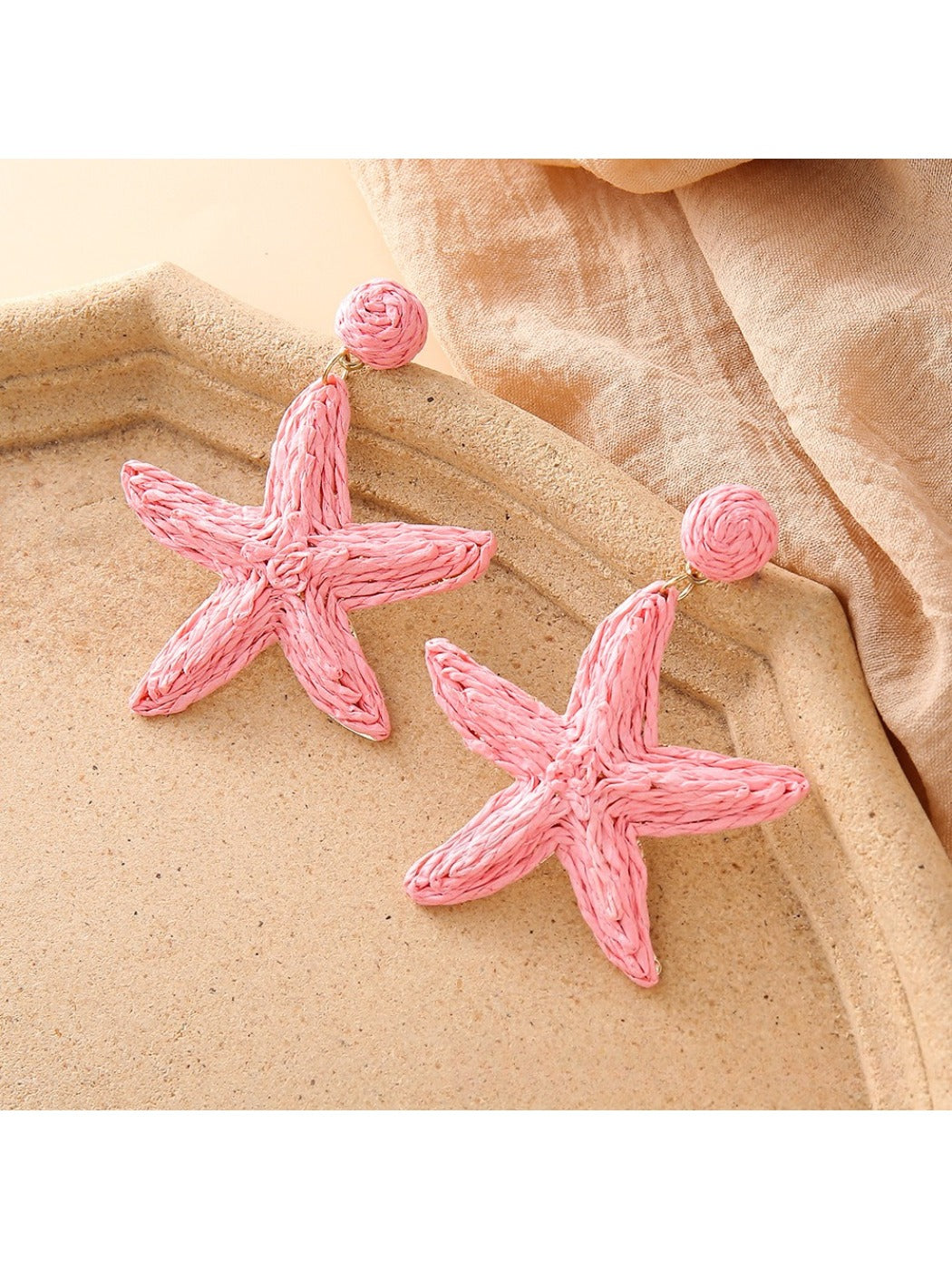 Earedge starfish drop earrings shown from front and side angles