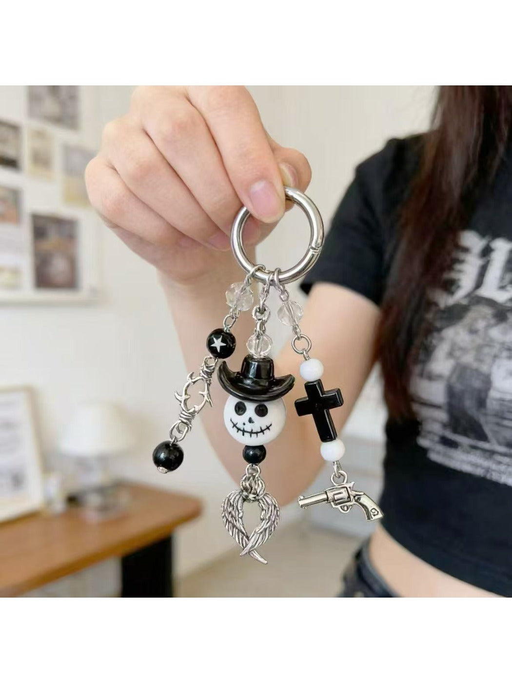 Side view of the minimalist ghost keychain highlighting its slim profile