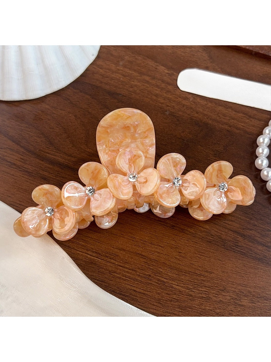 Beau elegant floral half round claw clip photographed with soft lighting
