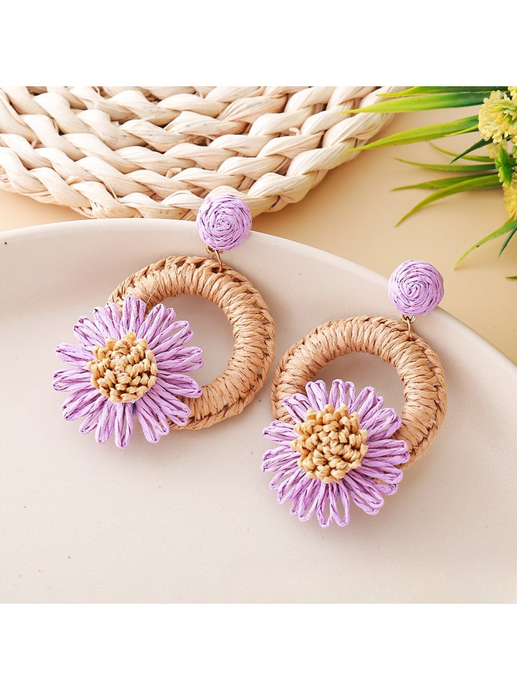 Top view of Earedge raffia daisy shaped stud earrings showing symmetrical design