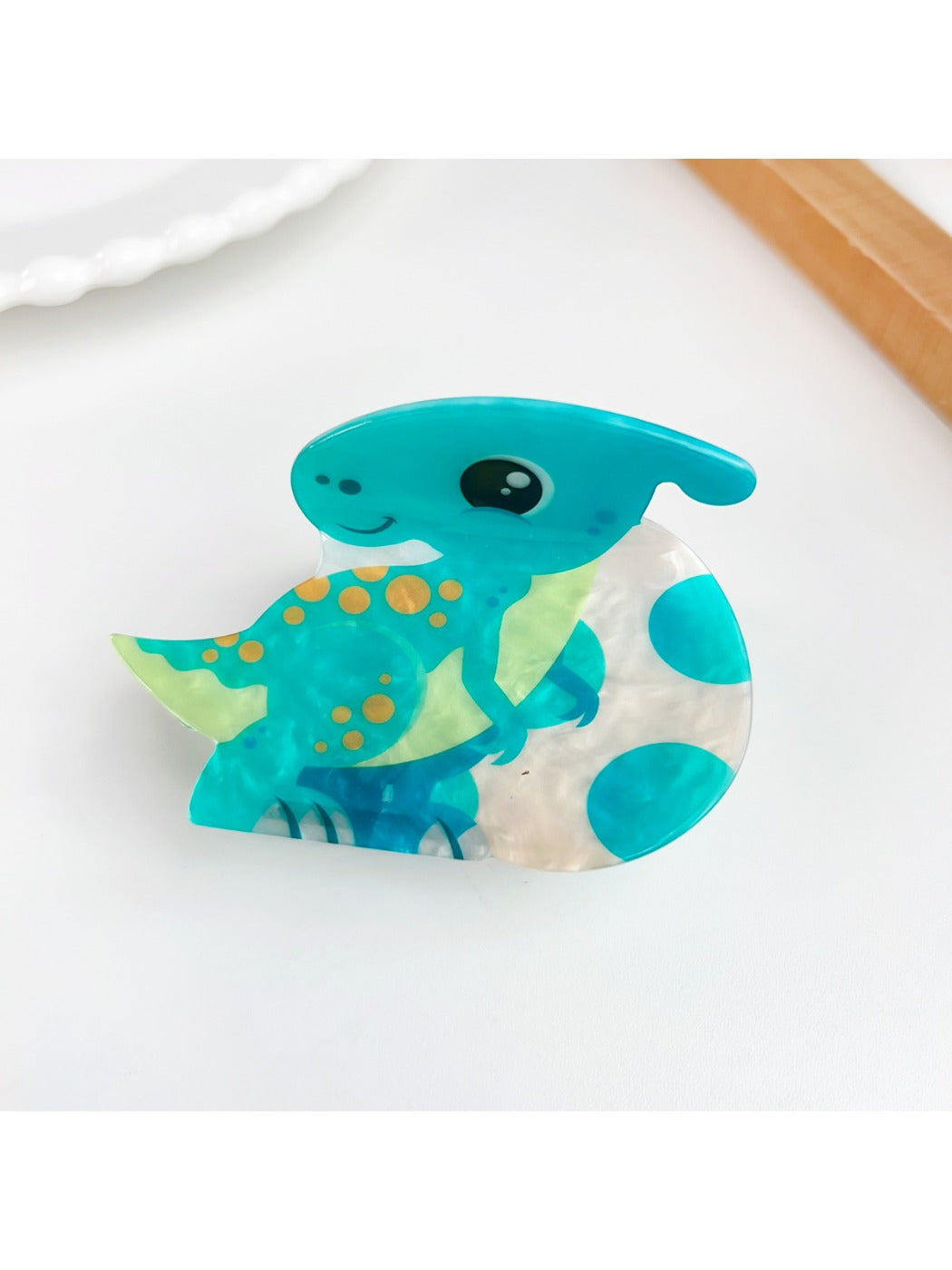 Beau hair claw clips in various animal shapes arranged on white background