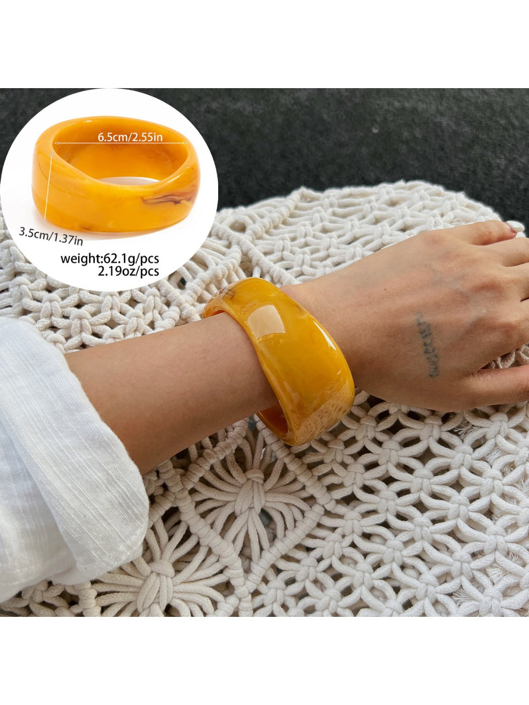 Lovra wide bangle bracelet with irregular contours styled with casual outfit