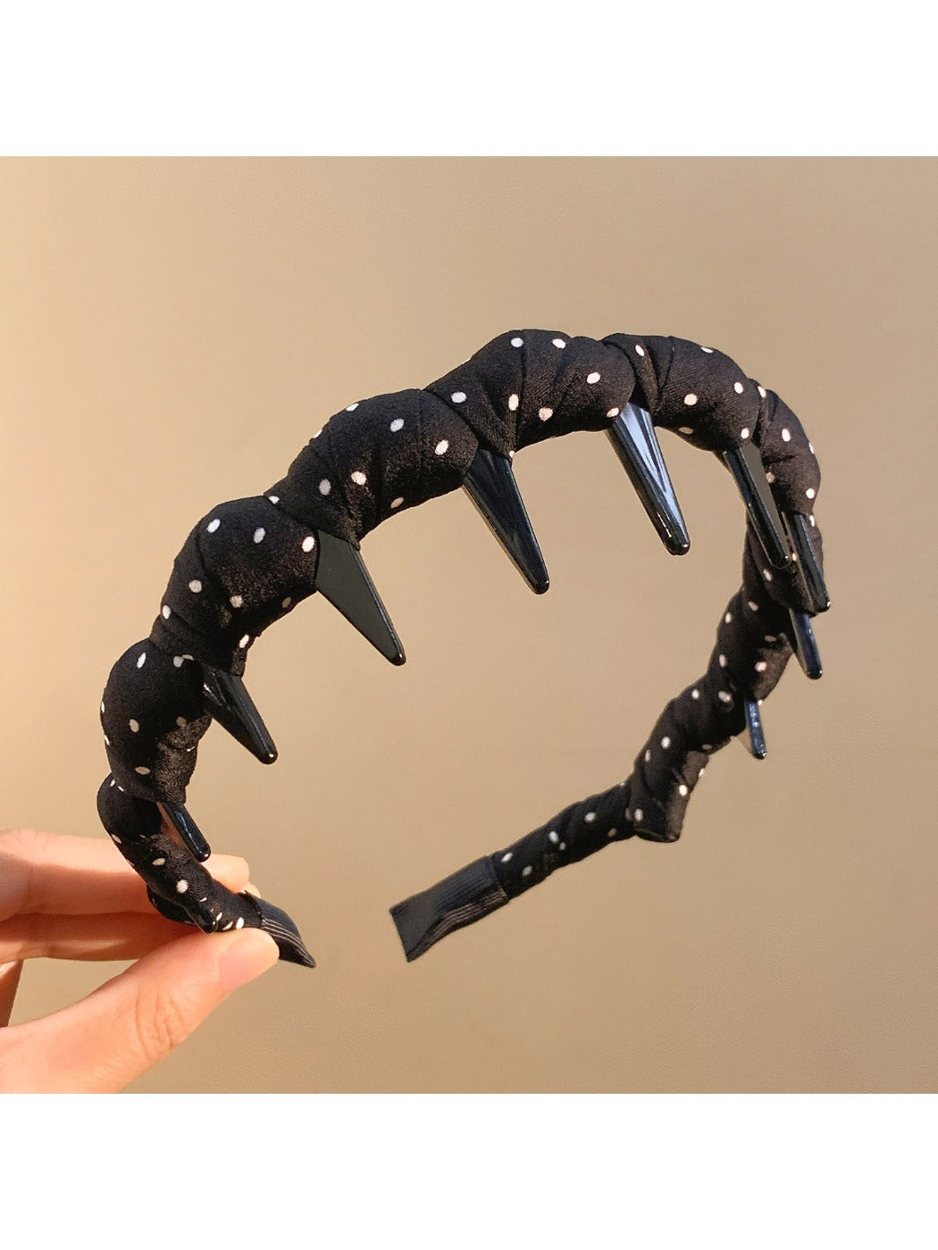 Gifty polka dot headband styled with matching accessories on table
