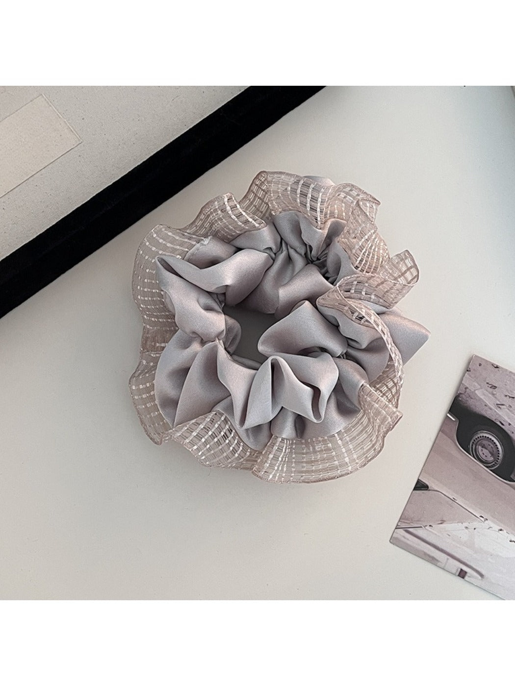 Gifty scrunchie displayed with matching hair accessories in coordinated colors